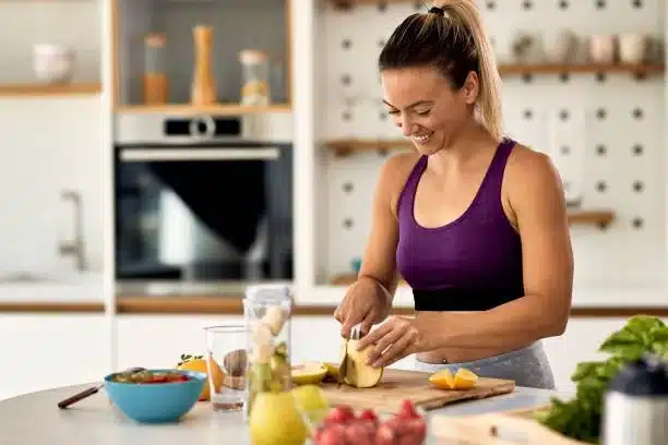 Coach preparing healthy meal in the kitchen